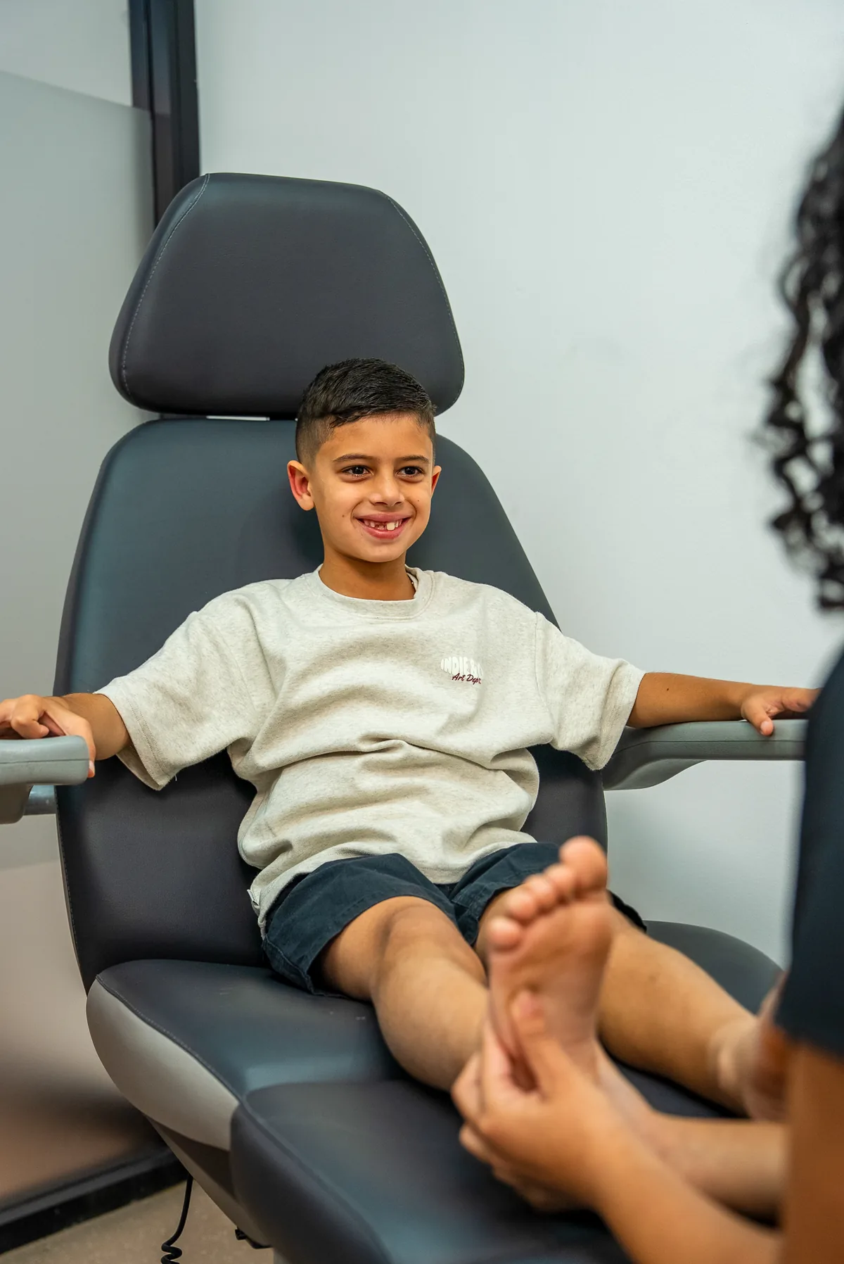 A podiatrist checking a child's foot at Bexley Podiatry