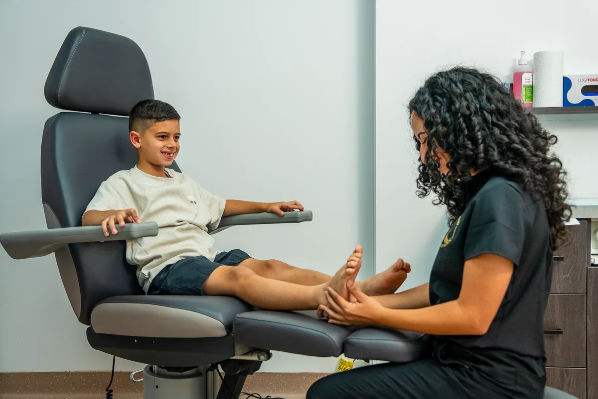 A podiatrist assessing a child's foot posture at the Bexley clinic