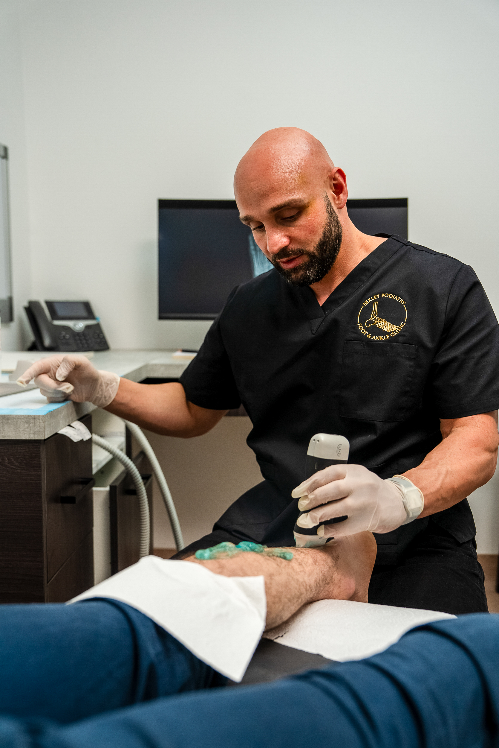 A Bexley Podiatry podiatrist delivering shockwave therapy