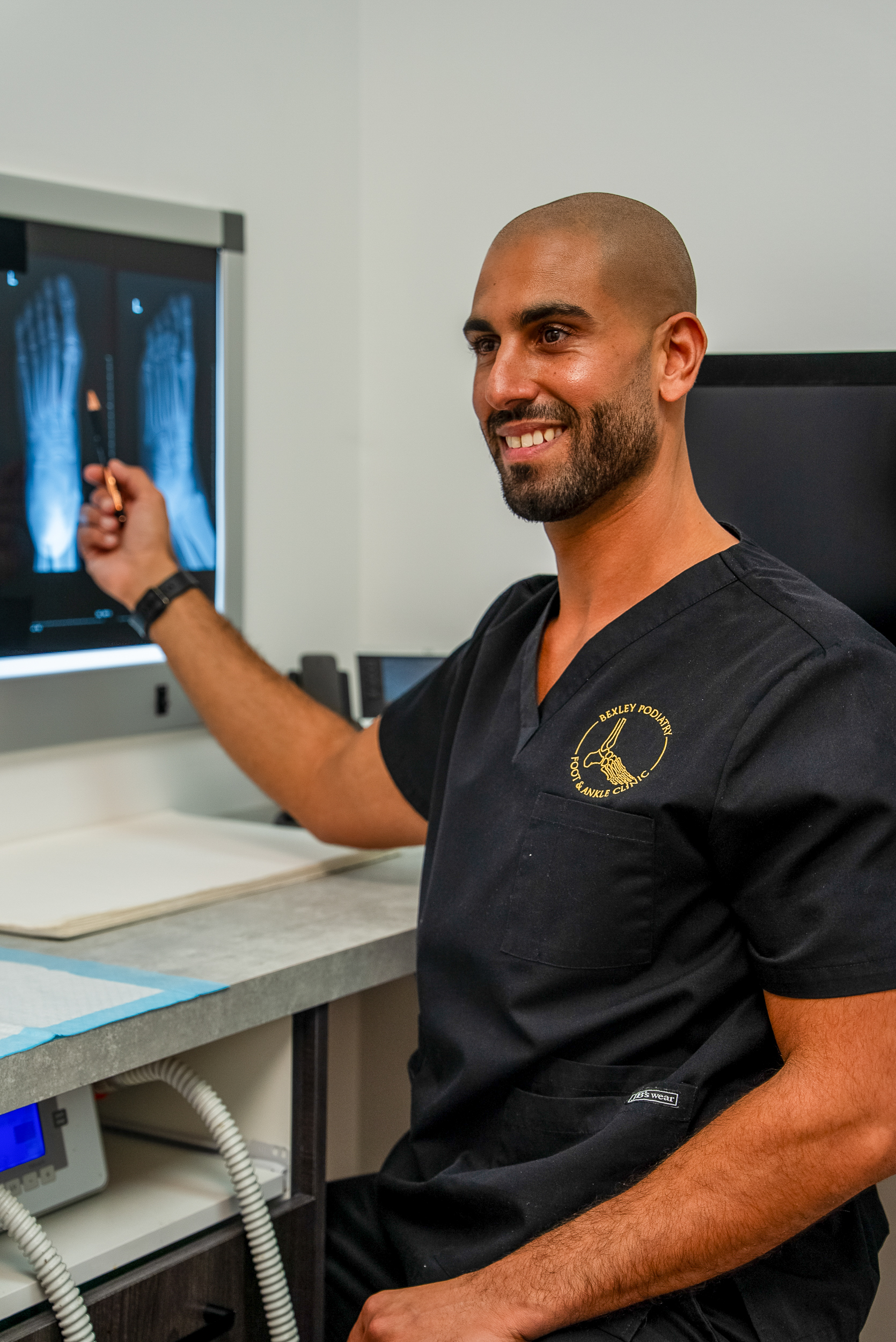 A Bexley Podiatry podiatrist reviewing a case in the clinic
