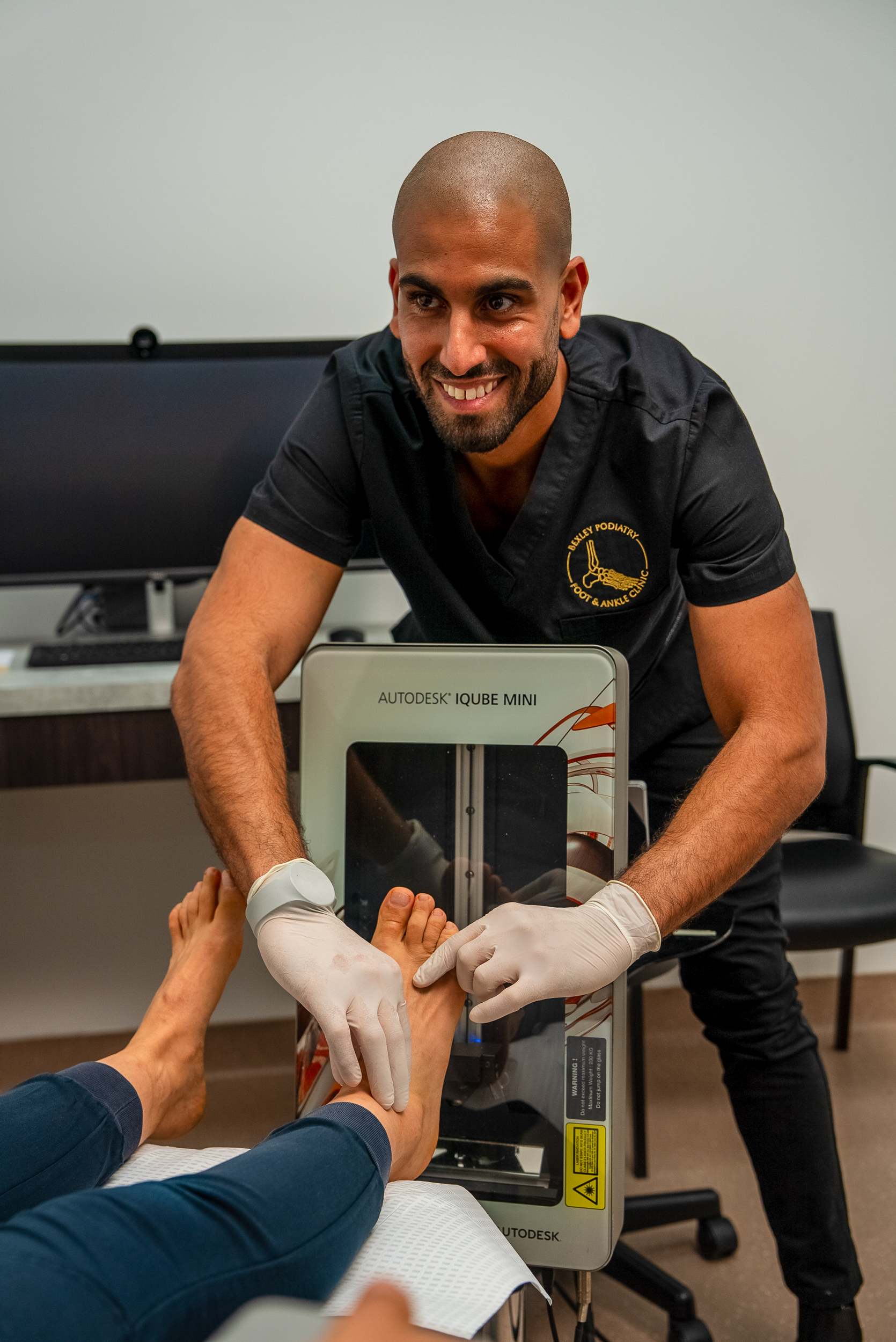 A Bexley Podiatry podiatrist delivering in-clinic treatment